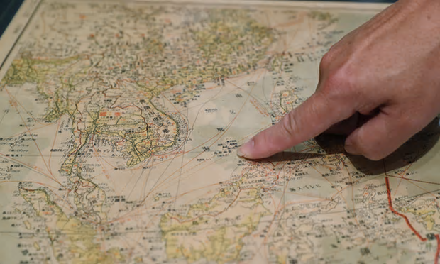 Hand pointing on a map